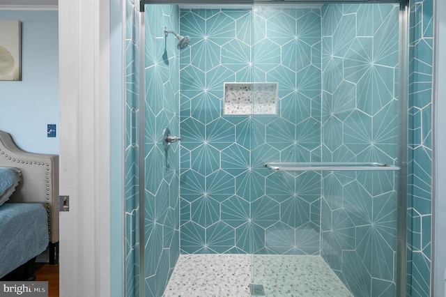 bathroom with a shower with shower door