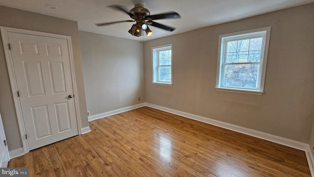 unfurnished bedroom featuring ceiling fan and light wood-type flooring