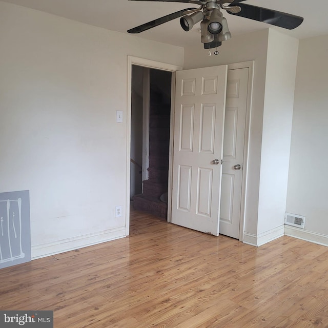 unfurnished bedroom featuring light hardwood / wood-style floors and ceiling fan