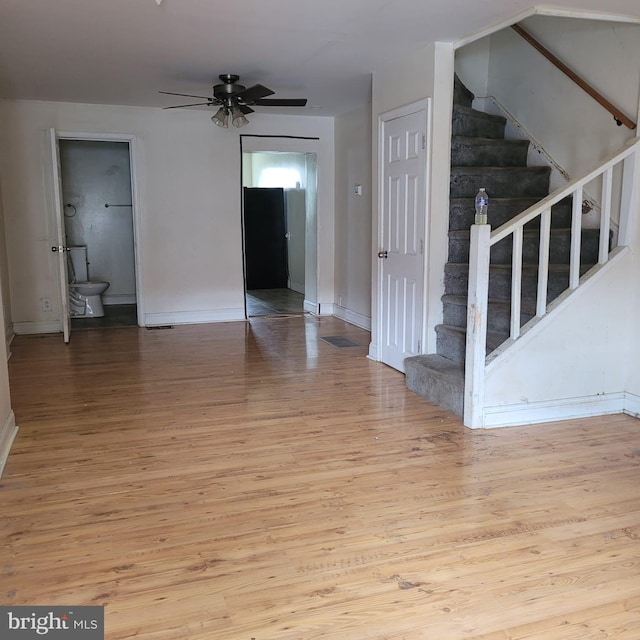 unfurnished room featuring ceiling fan and light wood-type flooring