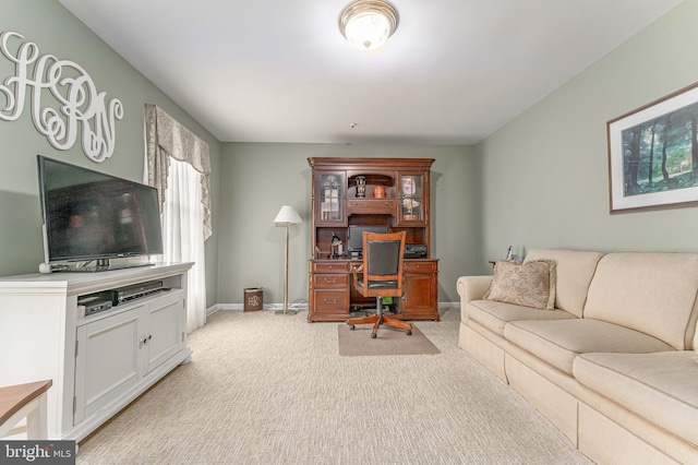 office area with light colored carpet and baseboards