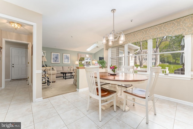 tiled dining room featuring plenty of natural light, carpet, baseboards, and a chandelier