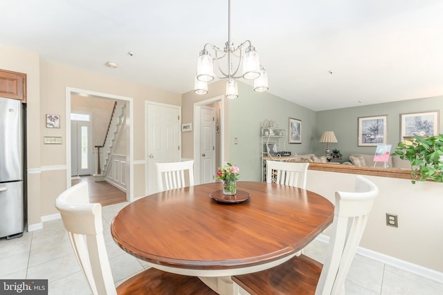 dining space featuring stairs, baseboards, an inviting chandelier, and light tile patterned floors