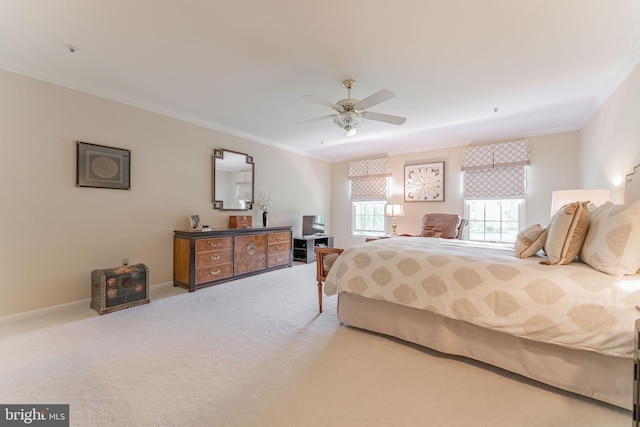 bedroom featuring crown molding, baseboards, ceiling fan, and light colored carpet