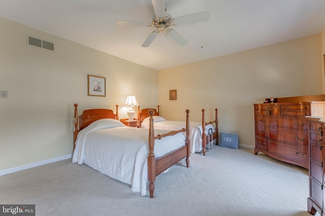 bedroom featuring visible vents, carpet flooring, baseboards, and a ceiling fan