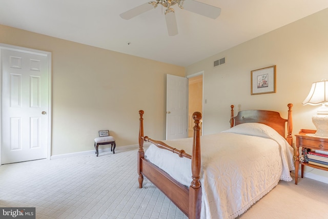 bedroom featuring baseboards, ceiling fan, light carpet, and visible vents