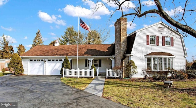 front facade with a garage and a front yard