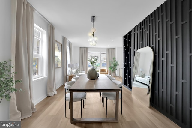 dining space with light wood-type flooring