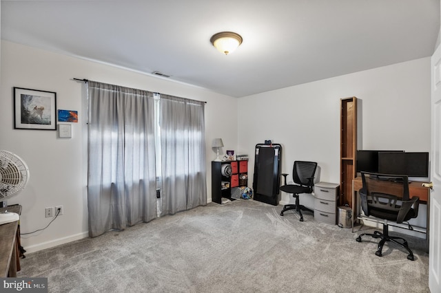 office area with light carpet, baseboards, and visible vents