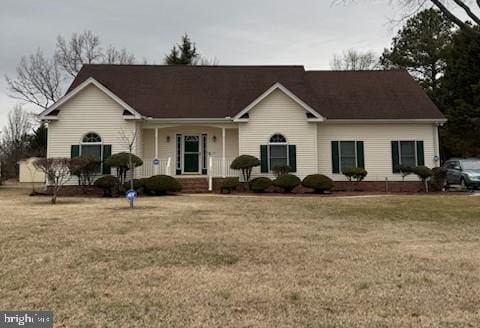 ranch-style home featuring a front yard