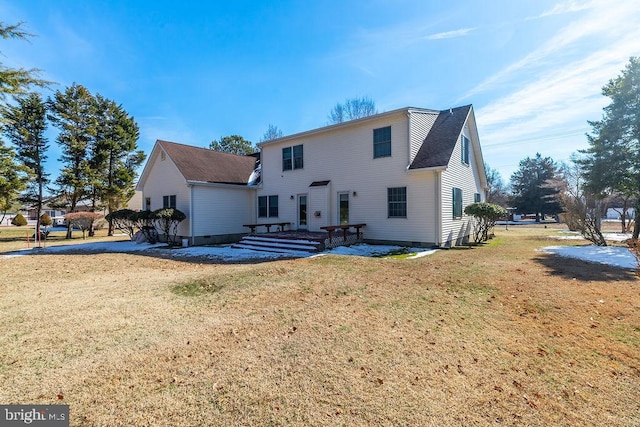 back of property featuring crawl space, a lawn, and a patio area