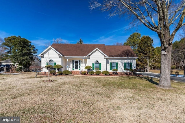 ranch-style home featuring a front yard