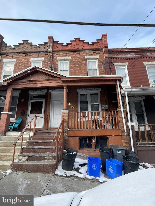 townhome / multi-family property featuring brick siding