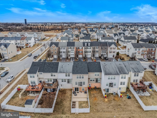 birds eye view of property with a residential view