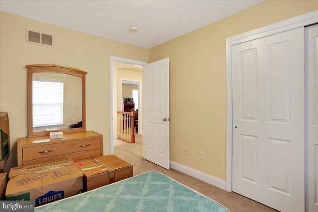 carpeted bedroom with a closet