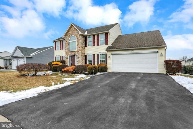 view of front of property featuring a garage