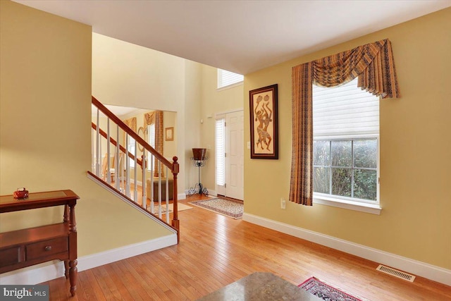 foyer entrance featuring hardwood / wood-style floors