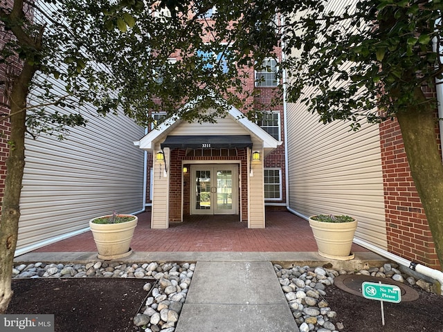 property entrance featuring french doors