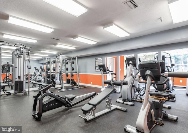 gym with a textured ceiling