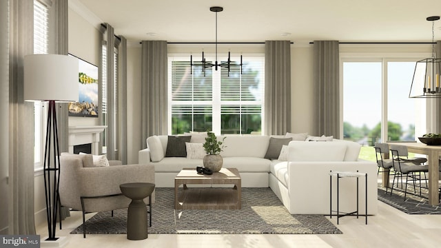 living room with an inviting chandelier and light hardwood / wood-style floors