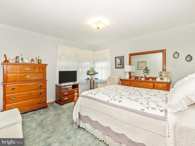 bedroom with light carpet