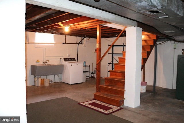 basement featuring washer / clothes dryer and sink