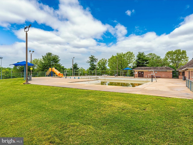 surrounding community with a playground, a patio area, and a lawn