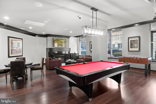 playroom featuring pool table, ornamental molding, and dark hardwood / wood-style floors