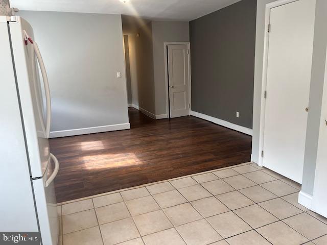 unfurnished room featuring light tile patterned floors