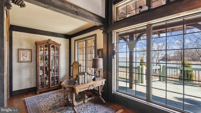 office with beam ceiling, dark wood-style flooring, and baseboards