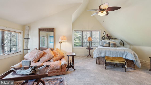 bedroom with light carpet, ceiling fan, vaulted ceiling, and baseboards