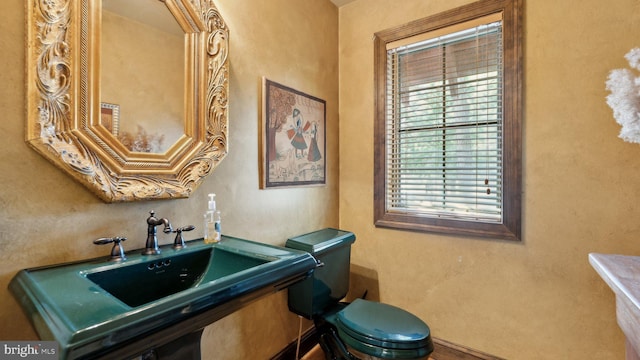 bathroom with a sink and toilet