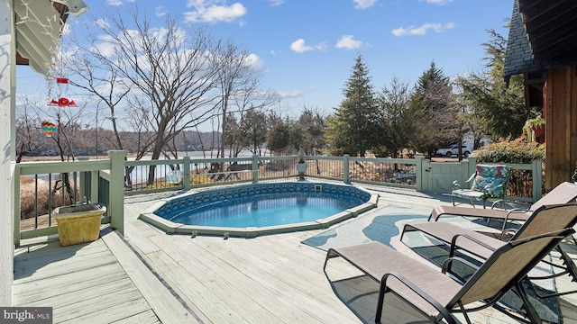 view of pool with a deck and a fenced in pool