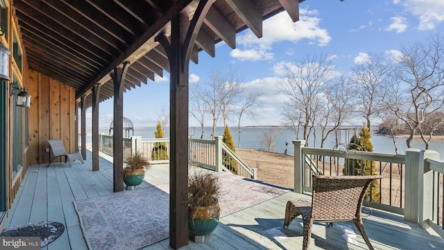 wooden deck with a water view