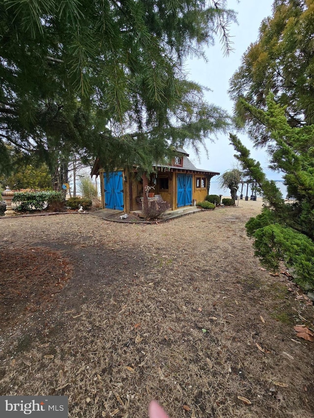 exterior space featuring an outbuilding