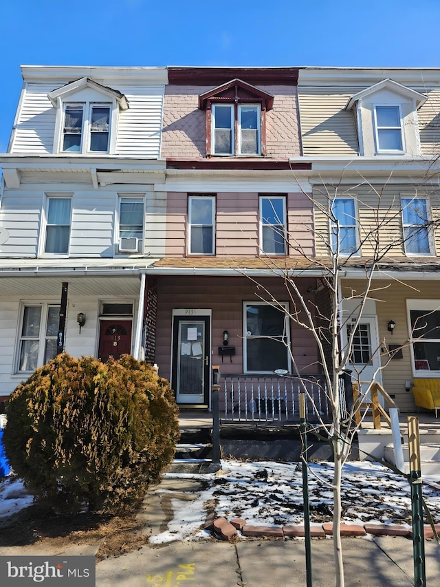 view of property with cooling unit and covered porch