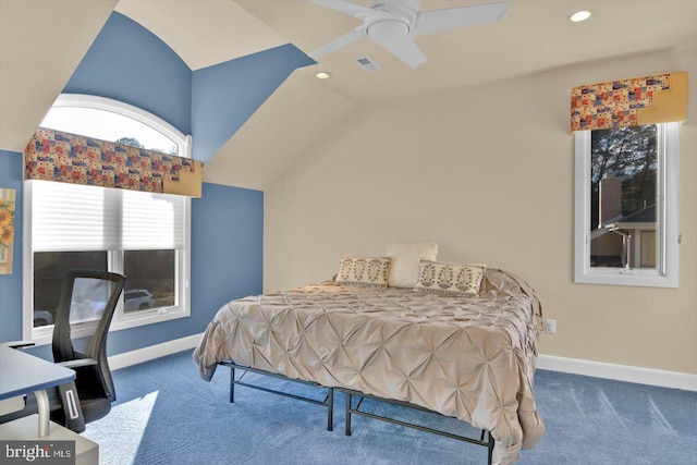 bedroom with ceiling fan, lofted ceiling, and dark carpet