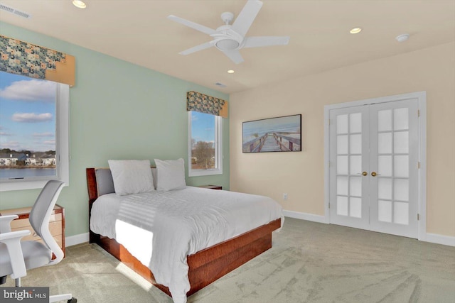 carpeted bedroom featuring french doors and ceiling fan