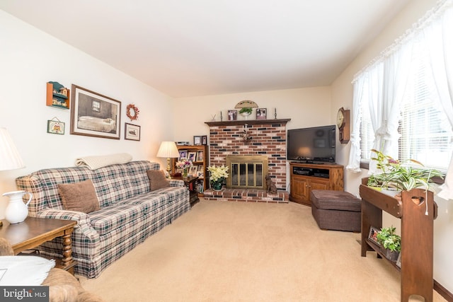 carpeted living room with a brick fireplace