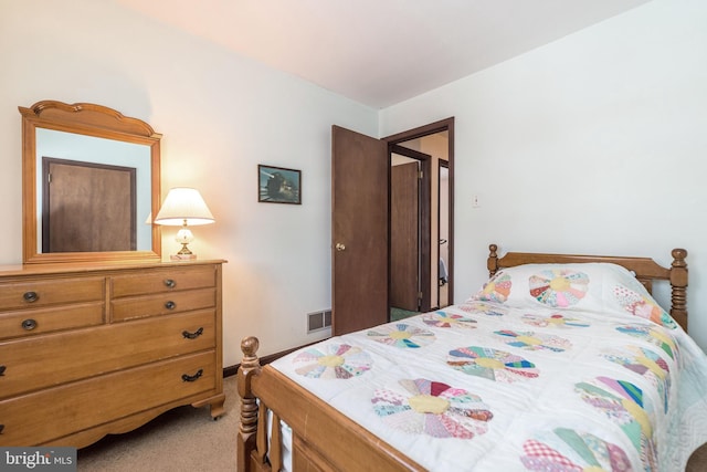 bedroom featuring light colored carpet