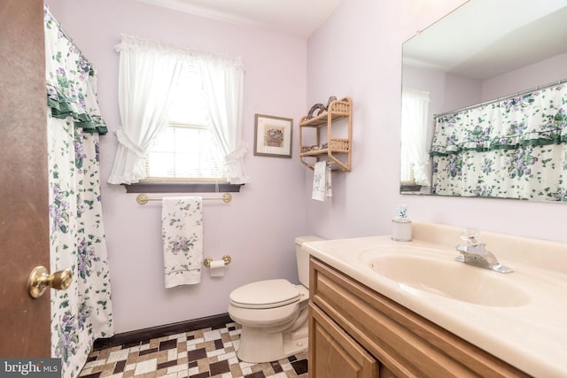 bathroom featuring vanity and toilet