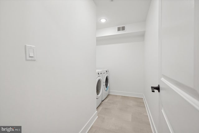 laundry room featuring washing machine and dryer