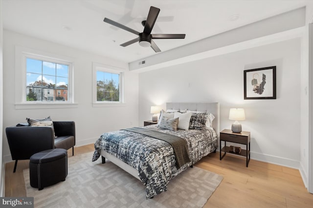 bedroom featuring ceiling fan and light hardwood / wood-style floors