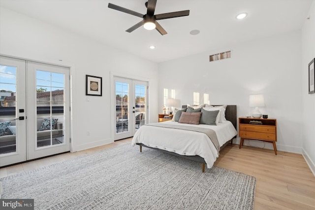 bedroom with french doors, access to outside, ceiling fan, and light hardwood / wood-style flooring