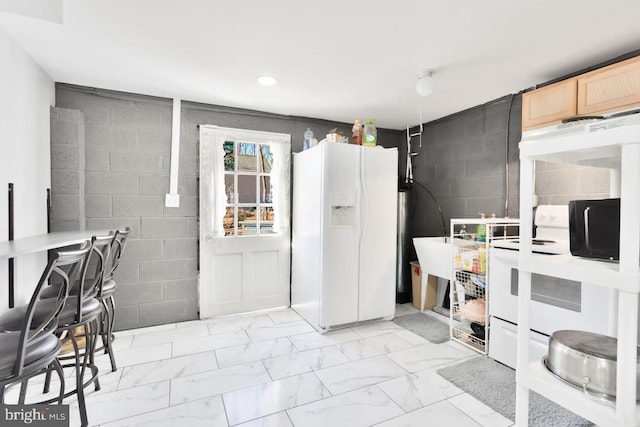 kitchen with white fridge with ice dispenser