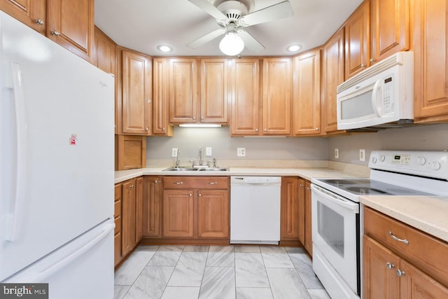 kitchen with sink, white appliances, and ceiling fan