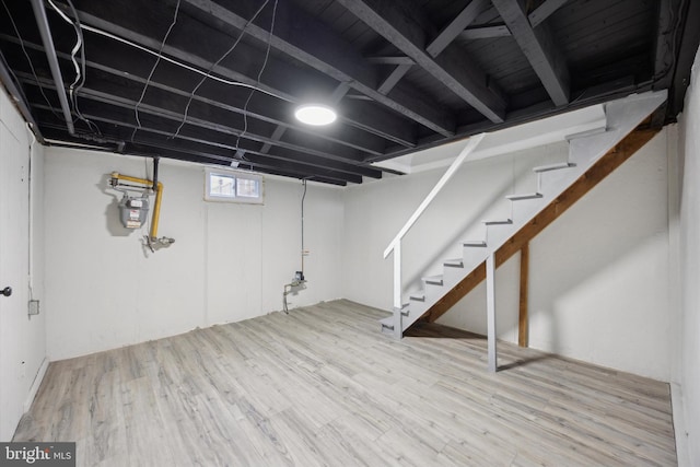 basement featuring hardwood / wood-style floors