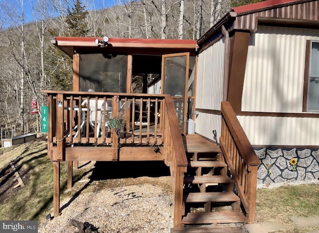 deck with a sunroom