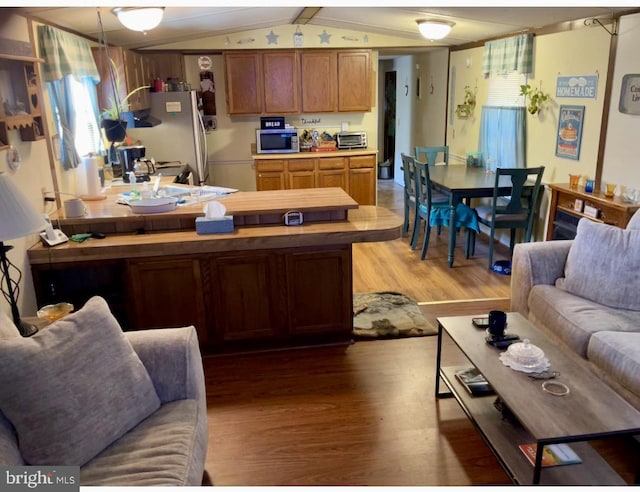 147 Day Owens Dr, Franklin, WV 26807 - kitchen with hardwood / wood-style flooring, appliances with stainless steel finishes, sink, and vaulted ceiling