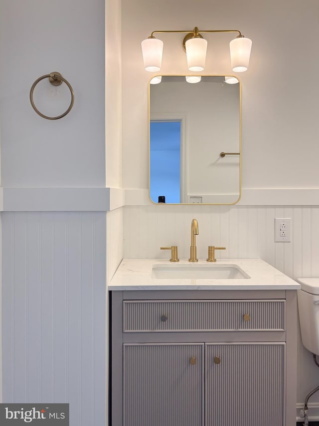 bathroom with vanity and toilet